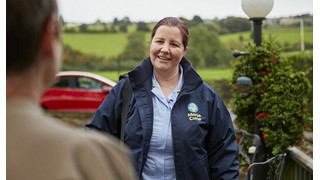 Marie Curie Nurse arrives at the home of a patient